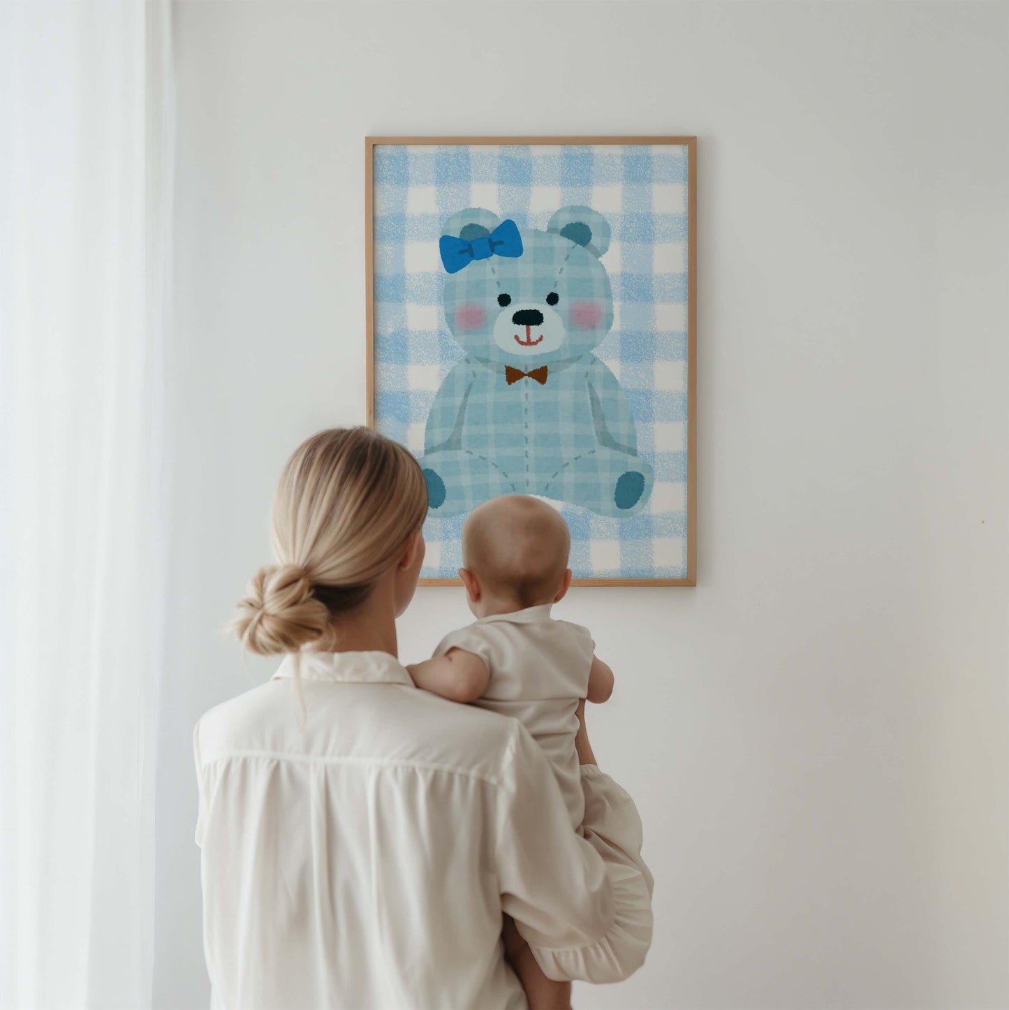 Blue gingham teddy bear nursery wall art print in a wooden frame, perfect for baby boy room decor. Features a cute teddy with a blue bow and a brown bow tie on a checkered background.